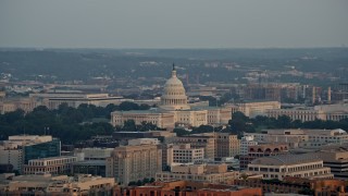 AX76_080E - 4.8K aerial stock footage flying by the United States Capitol, Washington D.C., sunset