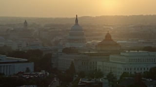 AX76_095 - 4.8K stock footage aerial video of the United States Capitol, Thomas Jefferson and John Adams buildings, Washington D.C., sunset