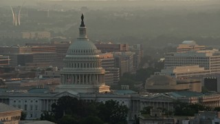 AX76_097 - 4.8K aerial stock footage of the United States Capitol, US Air Force Memorial in the background, Washington D.C., sunset