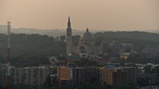 AX76_099 - 4.8K aerial stock footage of Basilica of the National Shrine of the Immaculate Conception, Washington D.C., sunset