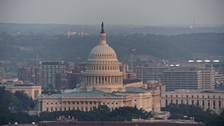 AX76_102 - 4.8K stock footage aerial video of the United States Capitol, Washington D.C., sunset
