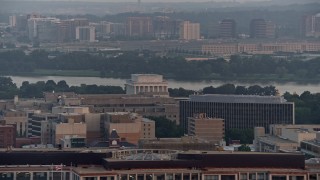 AX76_106 - 4.8K aerial stock footage of Lincoln Memorial, Pentagon in the background, Washington D.C., sunset