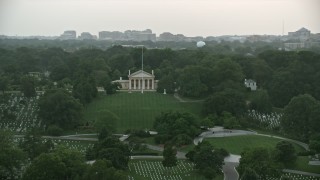 AX76_128 - 4.8K aerial stock footage of Arlington House and John F. Kennedy Gravesite at Arlington National Cemetery, Virginia, twilight