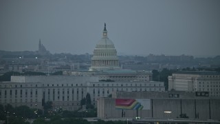 AX76_146 - 4.8K aerial stock footage United States Capitol, Rayburn House Office Building, Washington, D.C., twilight