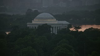 AX76_148 - 4.8K aerial stock footage flying by the Jefferson Memorial, Washington, D.C., twilight
