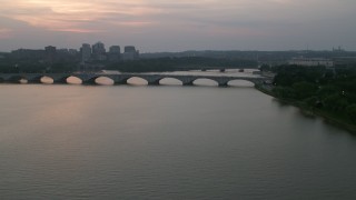 AX76_152 - 4.8K aerial stock footage approaching Arlington Memorial Bridge over the Potomac River, Washington, D.C., twilight