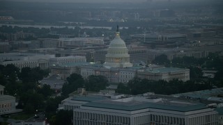 AX76_166 - 4.8K aerial stock footage of the United States Capitol building in Washington, D.C., twilight