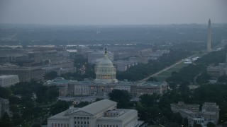 AX76_167 - 4.8K stock footage aerial video of United States Capitol, Washington Monument, and the Thomas Jefferson Building, Washington, D.C., twilight