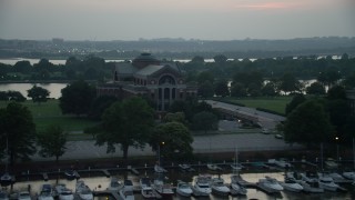 AX76_175 - 4.8K aerial stock footage of Roosevelt Hall at the National War College, Washington, D.C., twilight