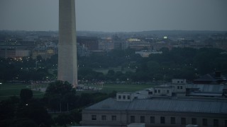 AX76_179 - 4.8K aerial stock footage of the White House and the Washington Monument lit up, Washington, D.C., twilight