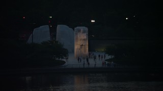 AX76_185 - 4.8K aerial stock footage of Martin Luther King Jr. National Memorial lit up for the night, Washington, D.C., twilight 