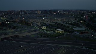 AX76_186 - 4.8K stock footage aerial video approaching The Pentagon in Washington, D.C., night
