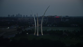 AX76_187 - 4.8K aerial stock footage orbiting the United States Air Force Memorial, Arlington, Virginia, twilight