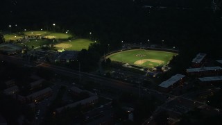 AX76_190 - 4.8K stock footage aerial video of baseball fields in Barcroft Park, Arlington, Virginia, night