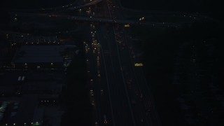 AX76_191 - 4.8K aerial stock footage of heavy traffic on Interstate 495, Springfield, Virginia, night