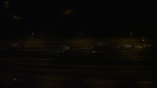 AX77_003E - 4.8K aerial stock footage of a bird's eye view of light traffic on Interstate 95, Alexandria, Virginia, night