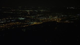 AX77_006 - 4.8K aerial stock footage of the George Washington Masonic National Monument and Interstate 95, Alexandria, Virginia, night