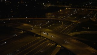 AX77_010 - 4.8K aerial stock footage panning across Interstate 95 to reveal Woodrow Wilson Memorial Bridge, Fort Washington, Maryland, night