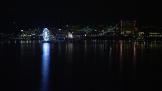 AX77_011 - 4.8K aerial stock footage of Capitol Wheel and Gaylord National Resort and Convention Center, National Harbor, Maryland, night