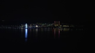 AX77_012 - 4.8K aerial stock footage approaching Capitol Wheel, Gaylord National Resort and Convention Center, National Harbor, Maryland, night