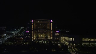 AX77_017 - 4.8K aerial stock footage of Gaylord National Resort & Convention Center, National Harbor, Maryland, night