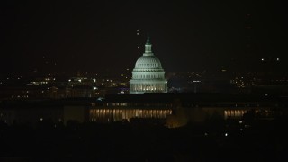 AX77_026E - 4.8K aerial stock footage of the United States Capitol in Washington, D.C., night
