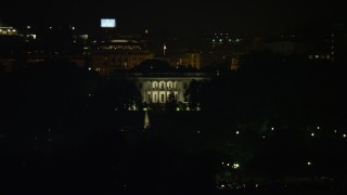 AX77_047E - 4.8K aerial stock footage of The White House seen from the base of the Washington Monument, Washington, D.C., night