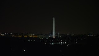 AX77_056E - 4.8K aerial stock footage of the Washington Monument in Washington, D.C., night