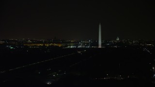AX77_058 - 4.8K stock footage aerial video of Washington Monument, National Mall, Capitol Building, Lincoln Memorial, Washington, D.C., night
