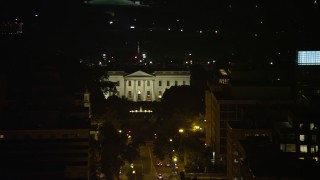 AX77_065 - 4.8K aerial stock footage of The White House, tilt to reveal Washington Monument and Jefferson Memorial, Washington, D.C., night