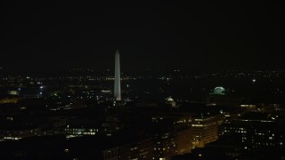 AX77_066 - 4.8K aerial stock footage of Washington Monument and the Jefferson Memorial in Washington, D.C., night