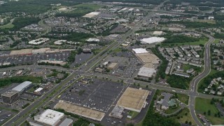 AX78_008E - 4.8K aerial stock footage of strip malls and shopping centers by Sudley Manor Drive in Manassas, Virginia