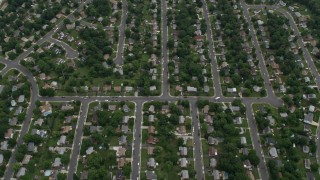AX78_010E - 4.8K aerial stock footage of suburban streets and neighborhoods with trees, Manassas, Virginia