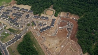 AX78_014 - 4.8K aerial stock footage of a bird's eye view of apartment buildings and construction in Manassas, Virginia