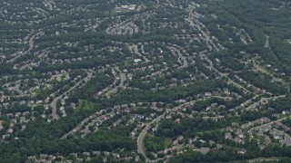 AX78_015 - 4.8K aerial stock footage of suburban homes on curved streets in Clifton, Virginia
