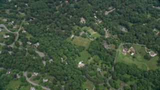 AX78_027 - 4.8K aerial stock footage of a bird's eye view of upscale homes, roads and pond, Herndon, Virginia
