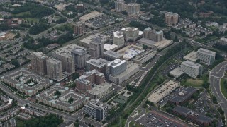 AX78_029E - 4.8K aerial stock footage of Reston Town Center apartment and office buildings, mall in Reston, Virginia
