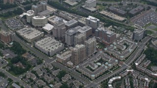 AX78_031E - 4.8K aerial stock footage of the Reston Town Center apartment and office complex, Reston, Virginia