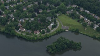 AX78_044 - 4.8K aerial stock footage of waterfront homes on Lake Whetstone in Gaithersburg, Maryland