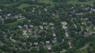 AX78_045 - 4.8K aerial stock footage tilting to a bird's eye view of a suburban neighborhood in Gaithersburg, Maryland