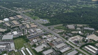 AX78_046 - 4.8K aerial stock footage of Inter-Denominational Church and stores Woodfield Road, Gaithersburg, Maryland