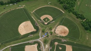AX78_049 - 4.8K aerial stock footage approaching baseball fields at OBGC Community Park in Olney, Maryland