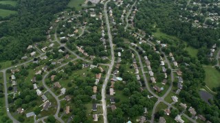 AX78_050E - 4.8K aerial stock footage flying over suburban neighborhoods in Olney, Maryland