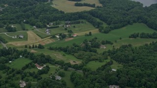 AX78_055E - 4.8K aerial stock footage of rural homes in Brookeville, Maryland