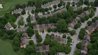 AX78_069 - 4.8K aerial stock footage approaching town houses on Fairway Hills Golf Course in Columbia, Maryland