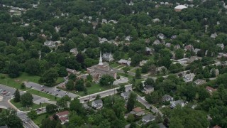 AX78_076E - 4.8K aerial stock footage approaching Catonsville Presbyterian Church and homes in Catonsville, Maryland