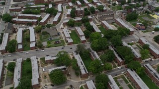 AX78_093 - 4.8K stock footage aerial video flying over public housing, Sweet Prospect Baptist, Baltimore City Correctional Center, Maryland