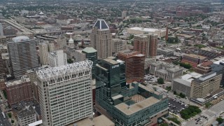 AX78_100 - 4.8K aerial stock footage of 100 East Pratt Street building, and The Gallery Mall and office tower in Baltimore, Maryland