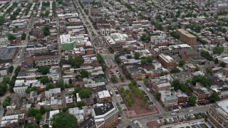 AX78_102E - 4.8K aerial stock footage of shops and apartment buildings beside Broadway in Baltimore, Maryland