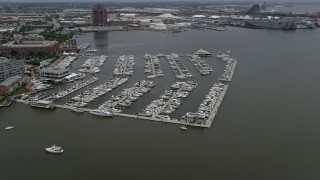 AX78_104 - 4.8K aerial stock footage of boats at the Baltimore Marine Center, Maryland